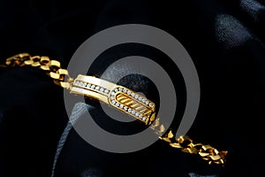 Gold with diamond bracelet isolated on black background