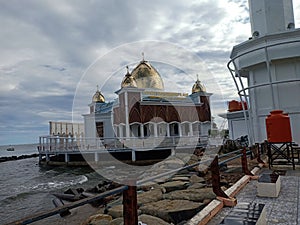 Gold dome floating mosque with unique architecture in Pesisir Selatan West Sumatra photo