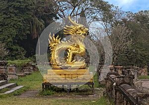 Gold dragon statue on the terrace of the garden of the Forbidden city,Imperial City inside the Citadel, Hue, Vietnam
