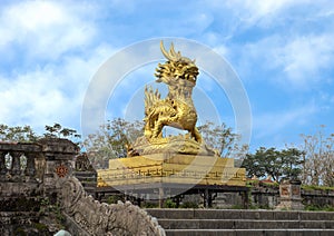 Gold dragon statue on the terrace of the garden of the Forbidden city,Imperial City inside the Citadel, Hue, Vietnam photo