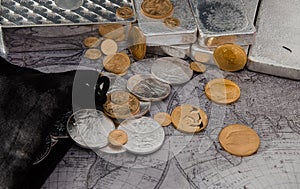Gold Eagle & Silver Eagle Coins with Silver Bars on Map