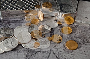 Gold Eagle & Silver Eagle Coins with Silver Bars on Map