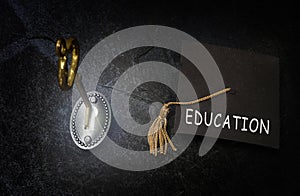 Gold education key and graduation cap