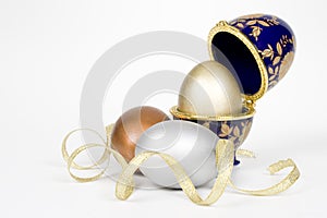 Gold egg in a eggcup