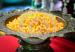 Gold egg yolks drops in pedestal tray