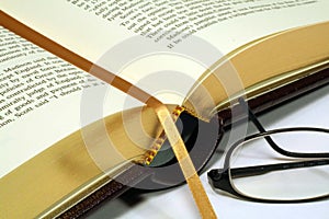 Gold Embossed Book with Reading Glasses