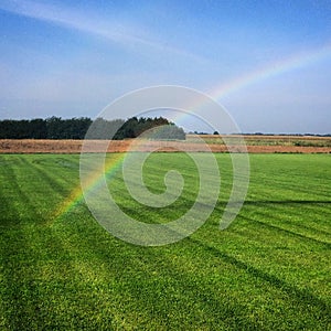 Gold at end of rainbow photo