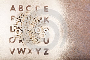 Gold English alphabet on a gold background