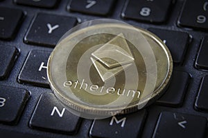 Gold Etherium Token on Keyboard