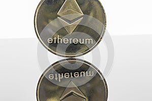 Gold Etherium Token with white background