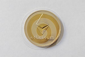 Gold Etherium Token with white background