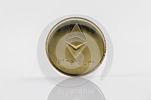 Gold Etherium Token with white background