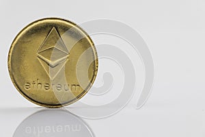 Gold Etherium Token with white background