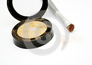 Gold eyeshadow and brush