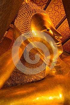 Gold face part of buddha statue in wat pho temple