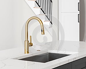 A gold faucet in a luxury kitchen.