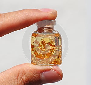 Gold flakes from Spain held in a hand