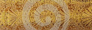 Gold floral ornament brocade textile pattern