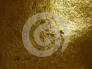 Gold foil background with rough grunge texture