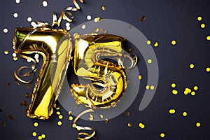 Gold foil balloon number, digit seventy-five. Birthday greeting card with inscription 75. Anniversary celebration