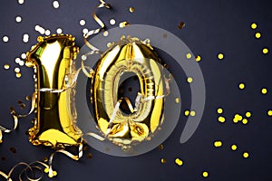 Gold foil balloon number, digit ten. Birthday greeting card with inscription 10. Anniversary celebration event. Banner