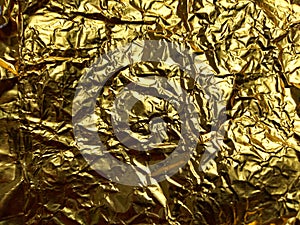 Gold foil crumpled rough texture background