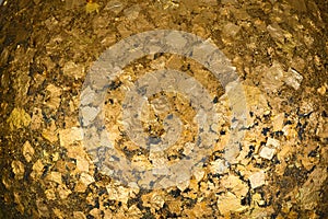 Gold foils pasted on the surface of Luuk Nimit round stones for