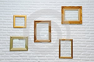 Gold frame on brick wall