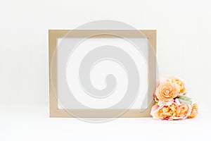 Gold frame mockup. Landscape empty frame mockup on white background with flowers photo