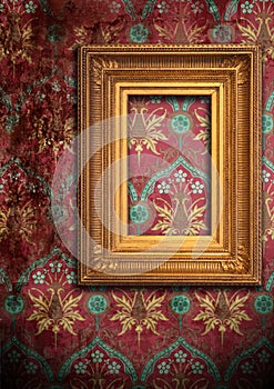 Gold frame and the old wallpaper