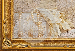 Gold frame surrounding pearls on antique purse