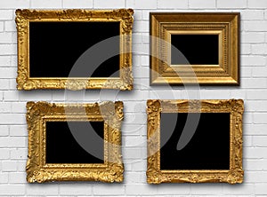 Gold Frames on Brick Wall