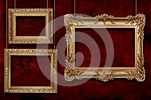 Gold Frames Hanging From Wire Poles photo