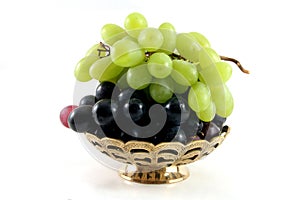 Gold fruit dish with grapes