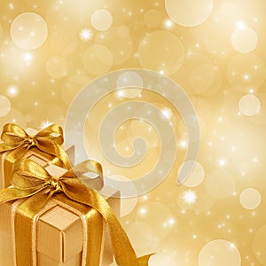 Gold gift box on abstract gold background