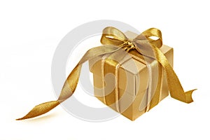 Gold gift box with gold ribbon isolated