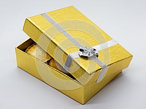 Gold gift box with golden coins