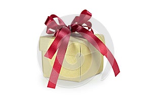 Gold gift box with red ribbon