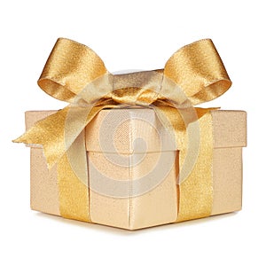 Gold gift box wrapped with golden ribbon and bow isolated on white