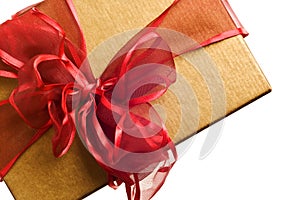 Gold gift with red bow isolated