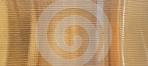 gold glass sheet wall or corrugated wall pattern texture use as background.