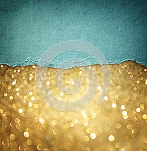 Gold glitter background and blue vintage torn paper . room for copy space.