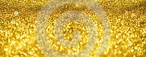 Gold glitter banner. Shiny abstract textured background with golden lights, bokeh. Christmas, new year concept with copy space for