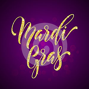 Gold glitter calligraphy Mardi Gras lettering for masquerade carnival photo