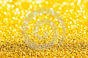 Gold glitter close-up background with shallow depth of field