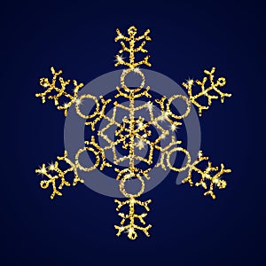 Gold glitter snowflake on dark blue background