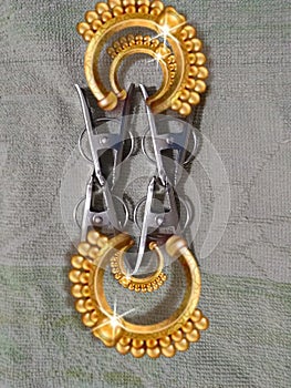 It is a Gold gold coloured ornate metal on gray colour background close up in Banglore India