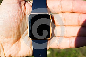 Gold golden blue smart watch turn off black screen close up