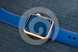 Gold golden blue smart watch turn off black screen close up