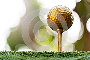 Gold golf ball and pins with a bright light, the ultimate victory of golf